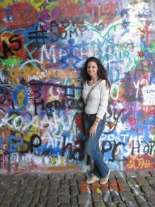 Emily in front of the Lennon Wall while studying abroad in Prague, Czech Republic.