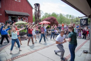 Amanda's fiancee, Paul, contacted the SUNY New Paltz Epic-Glee Club to organize a flash mob proposal at Water Street Market this past May.