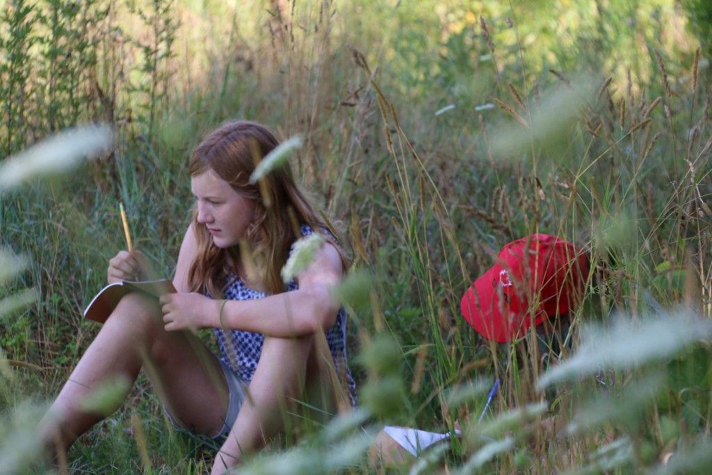 HUG_girl writing in gardens 1